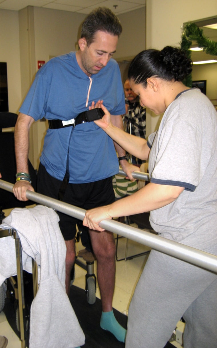 Tom Deierlein takes his first steps on Dec. 22, 2006 after months of bed rest at Walter Reed Army Medical Center in Washington, D.C.